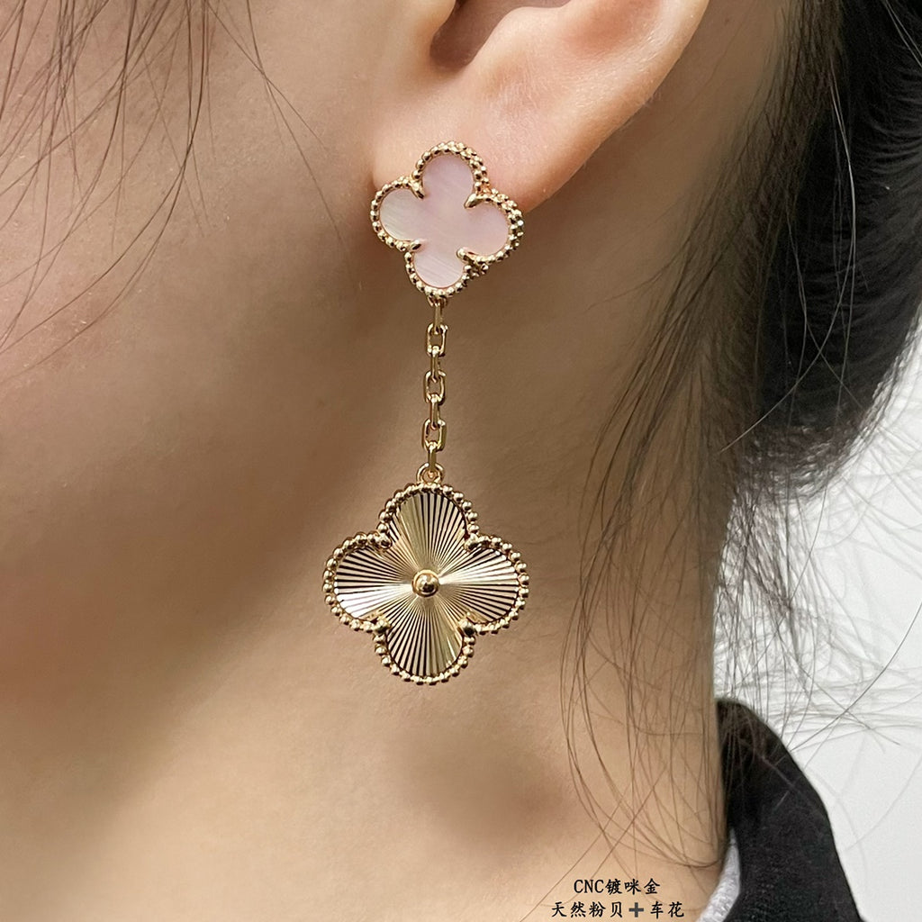 Gold-tone clover stud earrings with pink enamel and scalloped flower drop charm
