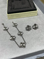 Silver-tone quatrefoil necklace with linked chain and five floral elements