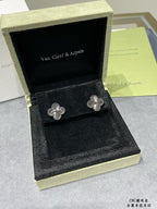 Quatrefoil stud earrings, silver-tone floral motif in black display box