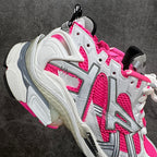 Unisex sneakers angled view, white and hot pink with thick molded midsole