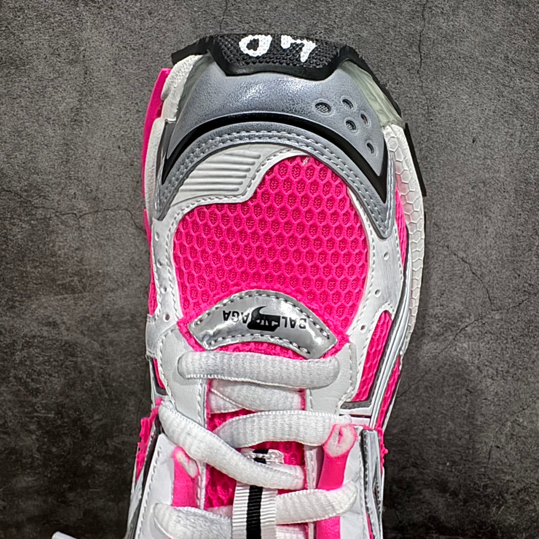 Toe and lace area of unisex sneakers, hot pink mesh and white leather trim