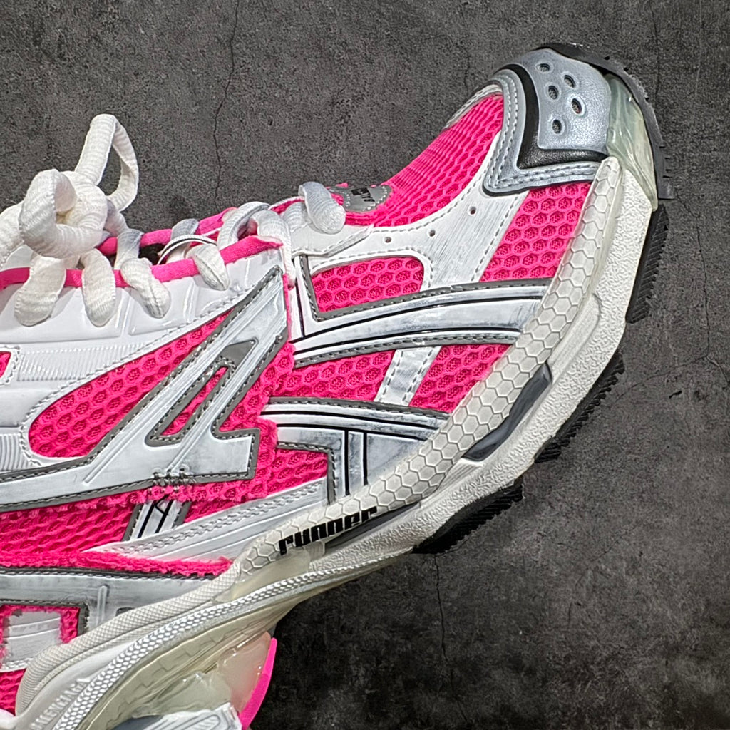 Unisex sneakers side view, pink and white uppers with textured gray outsole