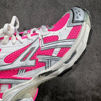 Unisex sneakers side view, pink and white uppers with textured gray outsole