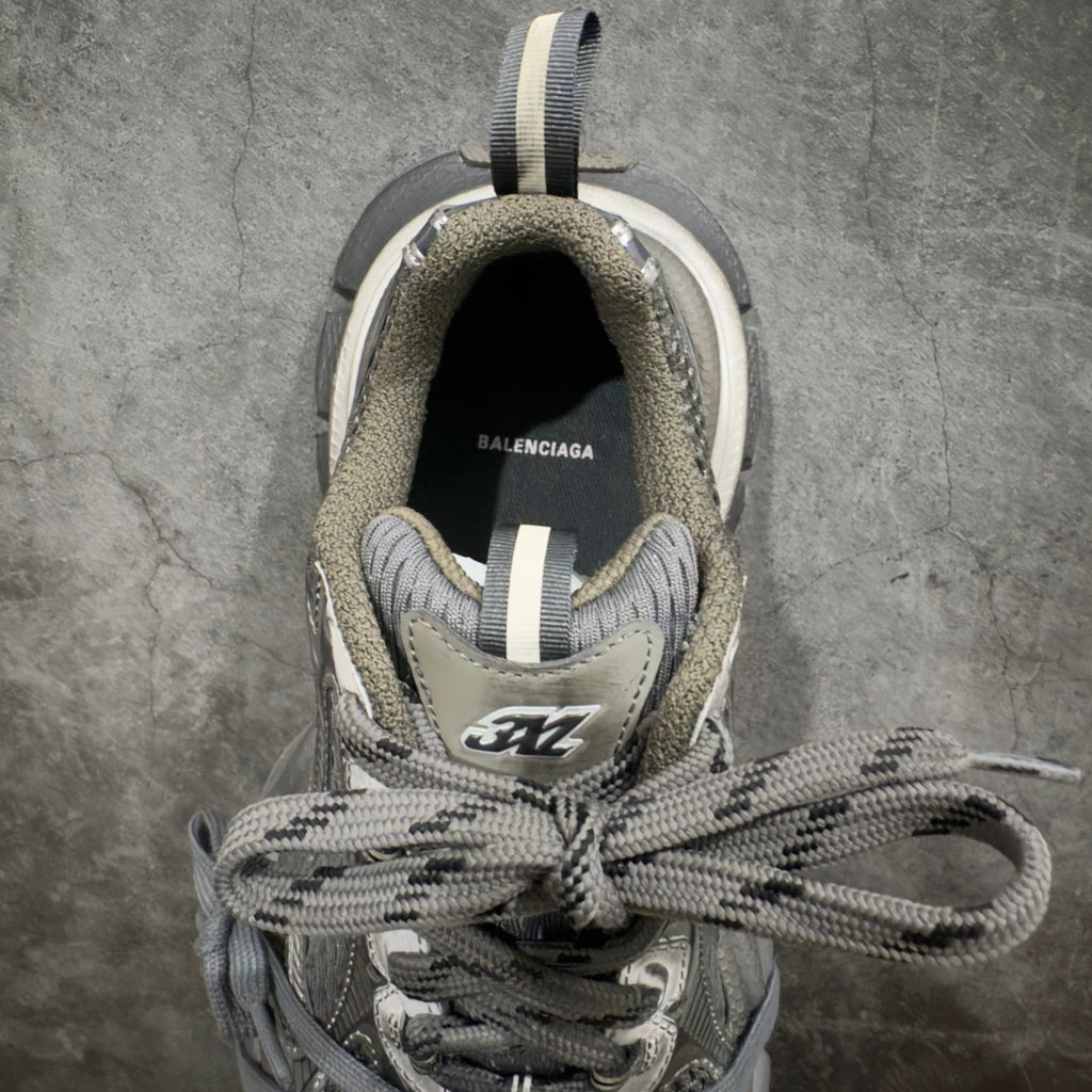 Balenciaga sneakers front view with open collar, gray knit lining, lace-up ties