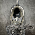 Balenciaga sneakers front view with open collar, gray knit lining, lace-up ties