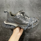 Balenciaga sneakers with gray mesh upper, lace-up front, chunky rubber sole