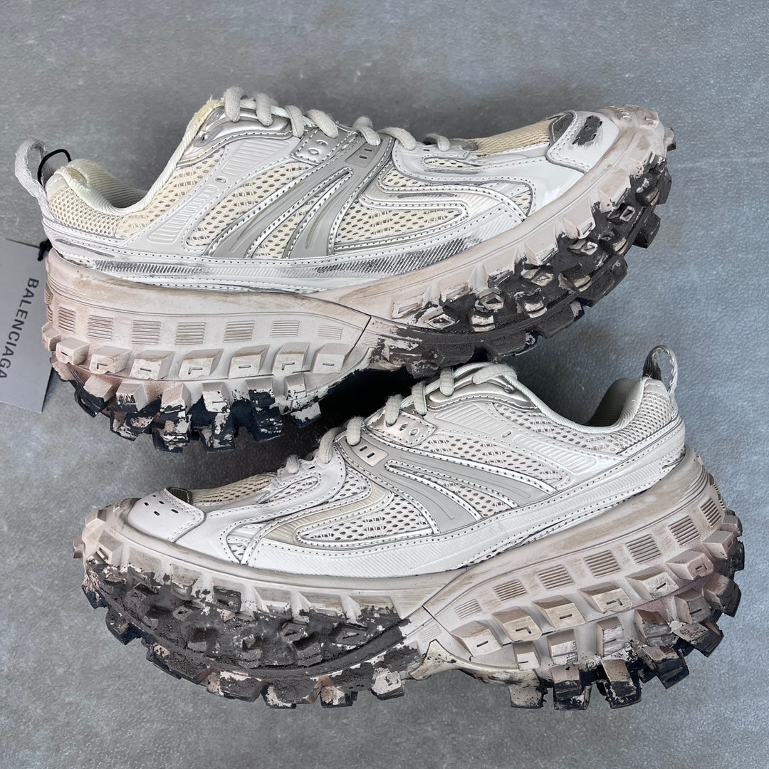 Unisex chunky sneakers side angle, light gray uppers with lace-up front and lug tread outsole.