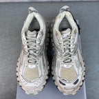 Unisex sneakers front view, light gray uppers with lace-up closure and rugged lug soles.
