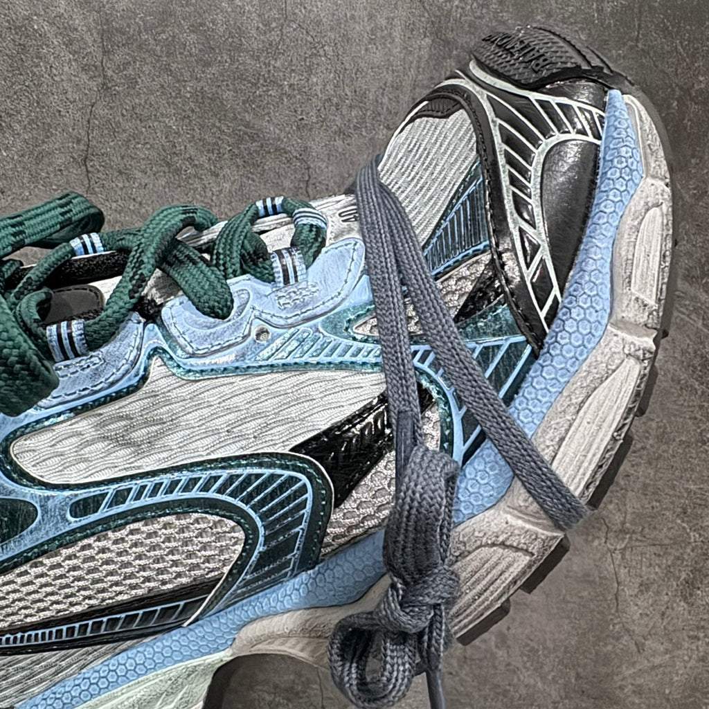 Balenciaga unisex sneakers side detail with dark blue accents and textured light blue sole