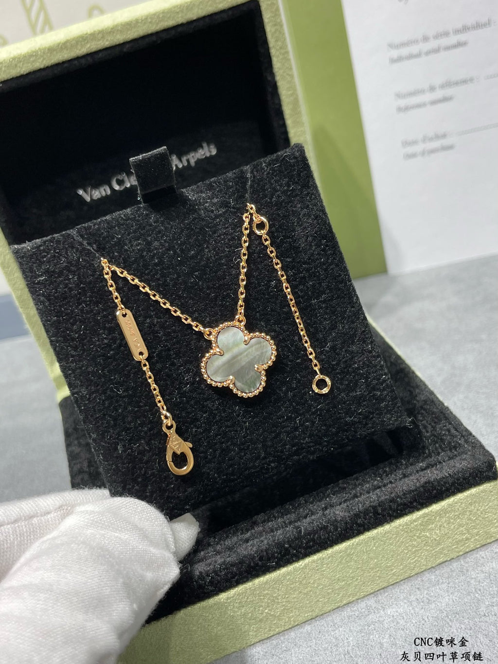 Van Cleef & Arpels accessories: gold clover pendant necklace with matching drop earrings in box