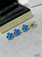 Blue clover stud earrings with gold-tone frames, plus a gold-tone pair