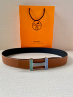 Brown leather belt with center striped green and blue buckle hardware