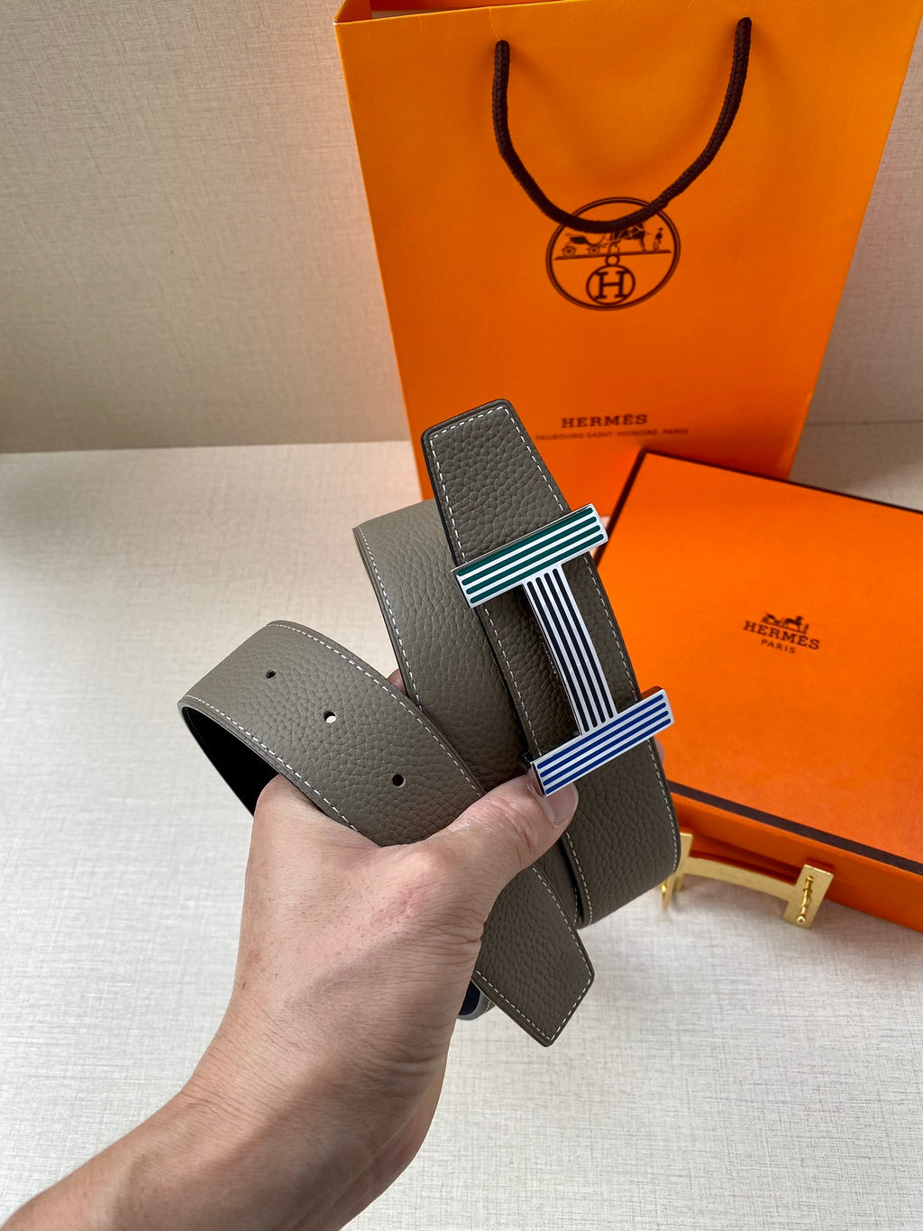 Hermes belt gray leather with striped buckle detail and stitched belt holes