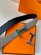 Hermes belt with gray and dark blue sides and striped buckle with gold frame