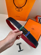 Hermes belt with dark blue textured leather strap and multicolor striped buckle