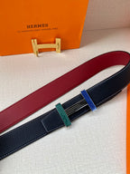 Hermes belt detail with dark blue strap, burgundy lining, and striped buckle