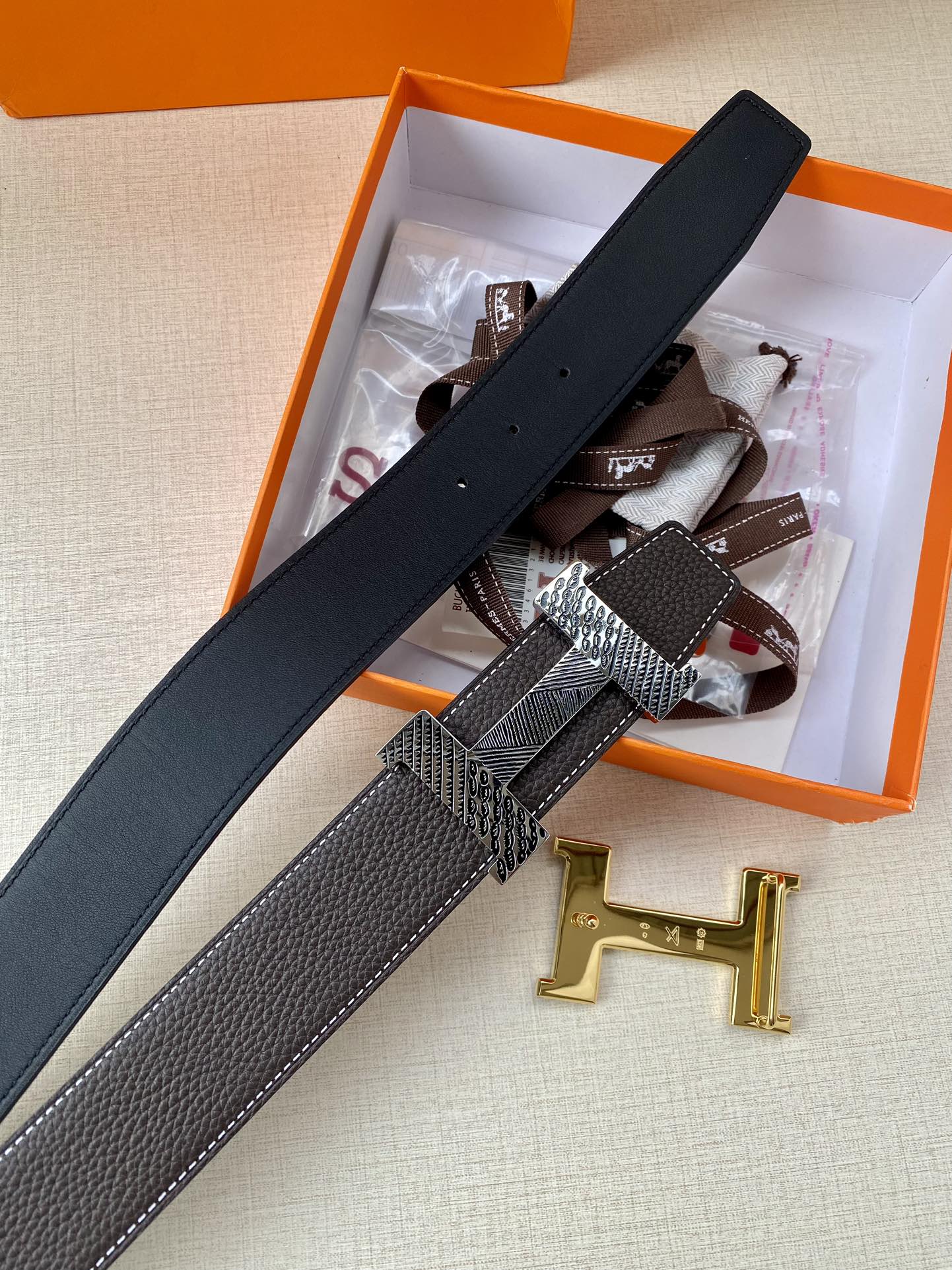 Hermes belt in black leather with long bar buckle and silver H hardware