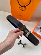 Hermes belt in black textured leather with gold-tone buckle and H-pattern strap