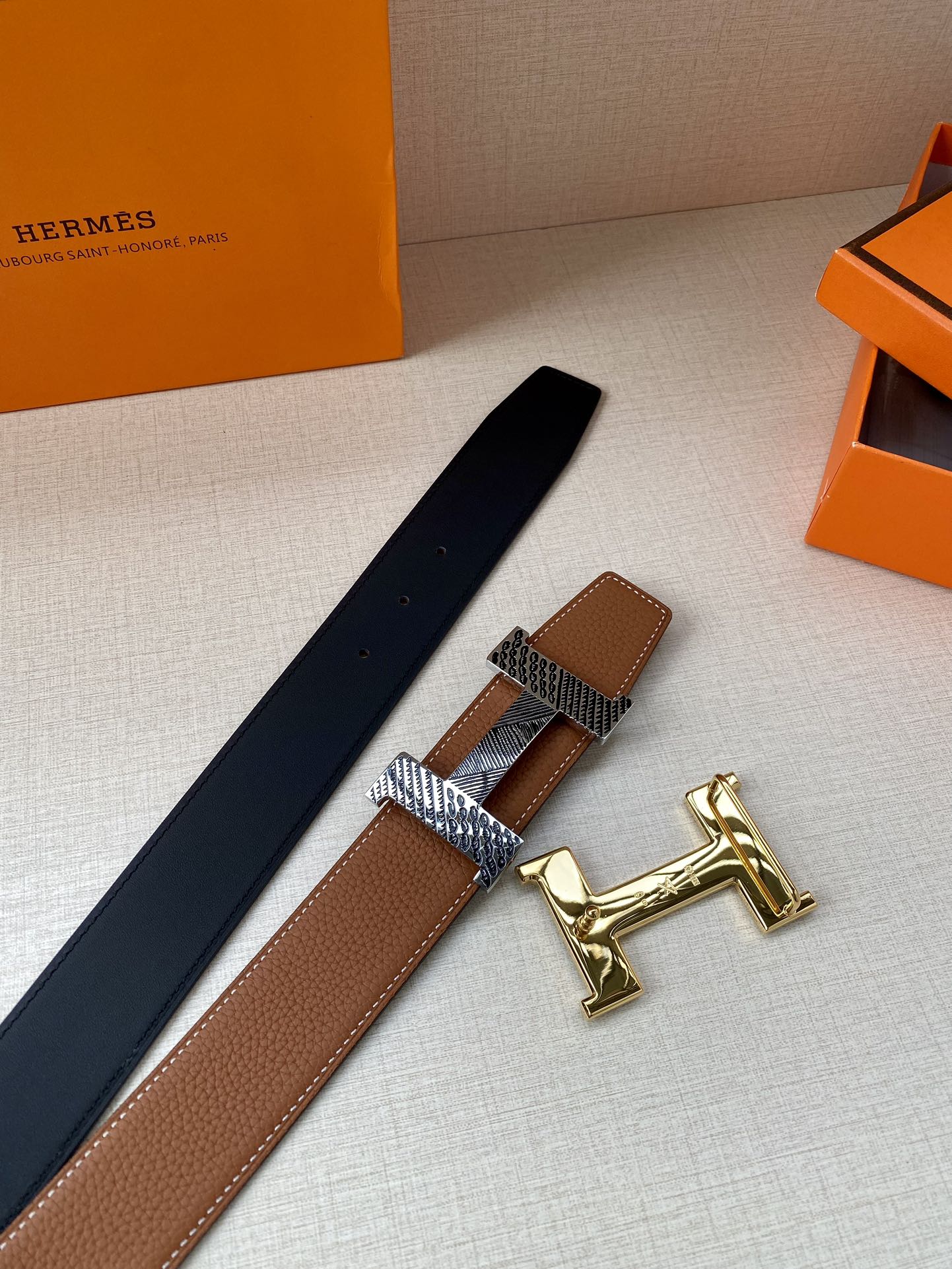 Hermes leather belt with brown strap, dark lining, and gold-tone H buckle