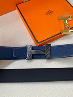 Blue leather belt with gold-tone buckle plate and interlocking textured center
