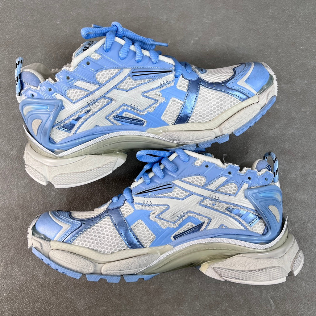 Balenciaga unisex chunky sneakers in light blue and white, side-by-side on floor