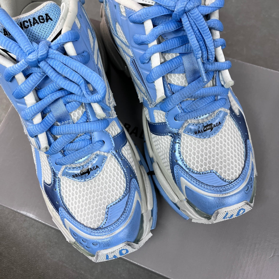 Balenciaga unisex sneakers close-up with blue laces and light blue logo details
