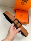 Hermes belt in tan leather with black underside and square buckle detail