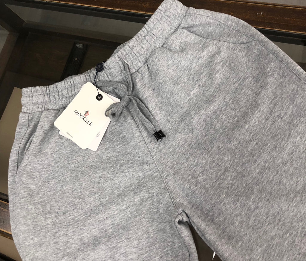 Light gray sweat shorts with drawstring and MONCLER hang tag