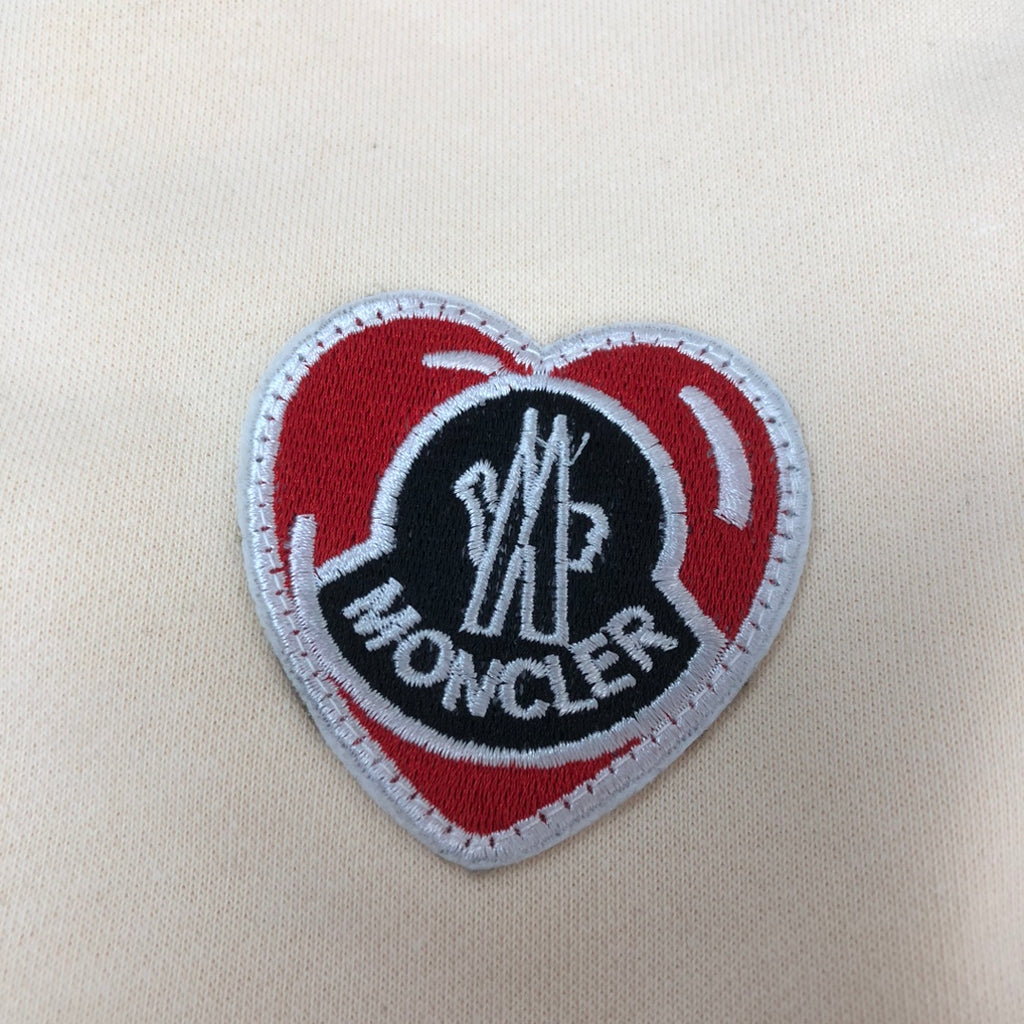 Stone Island shorts heart logo patch with red, white, and Moncler lettering