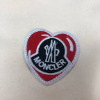 Stone Island shorts heart logo patch with red, white, and Moncler lettering