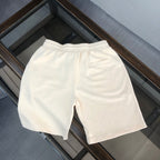 Stone Island cream shorts with elastic waistband and clean side seams