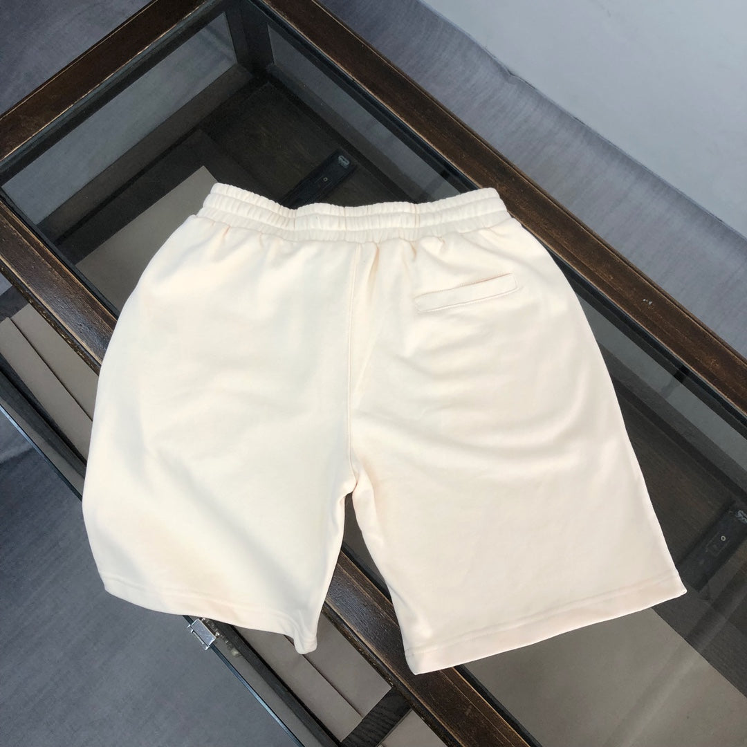 Stone Island cream shorts with elastic waistband and clean side seams