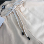 Stone Island cream shorts with elastic waistband and white drawstring