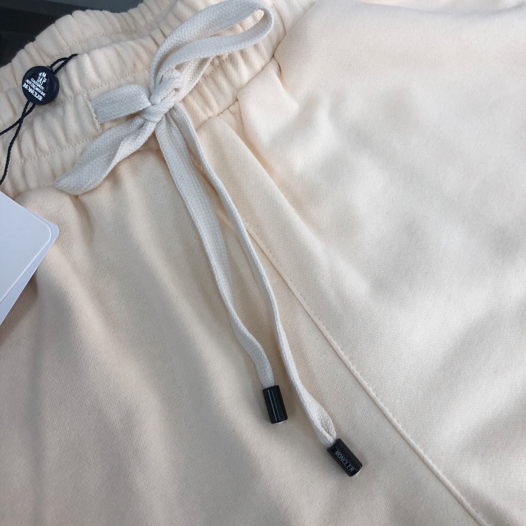 Stone Island cream shorts with elastic waistband and white drawstring