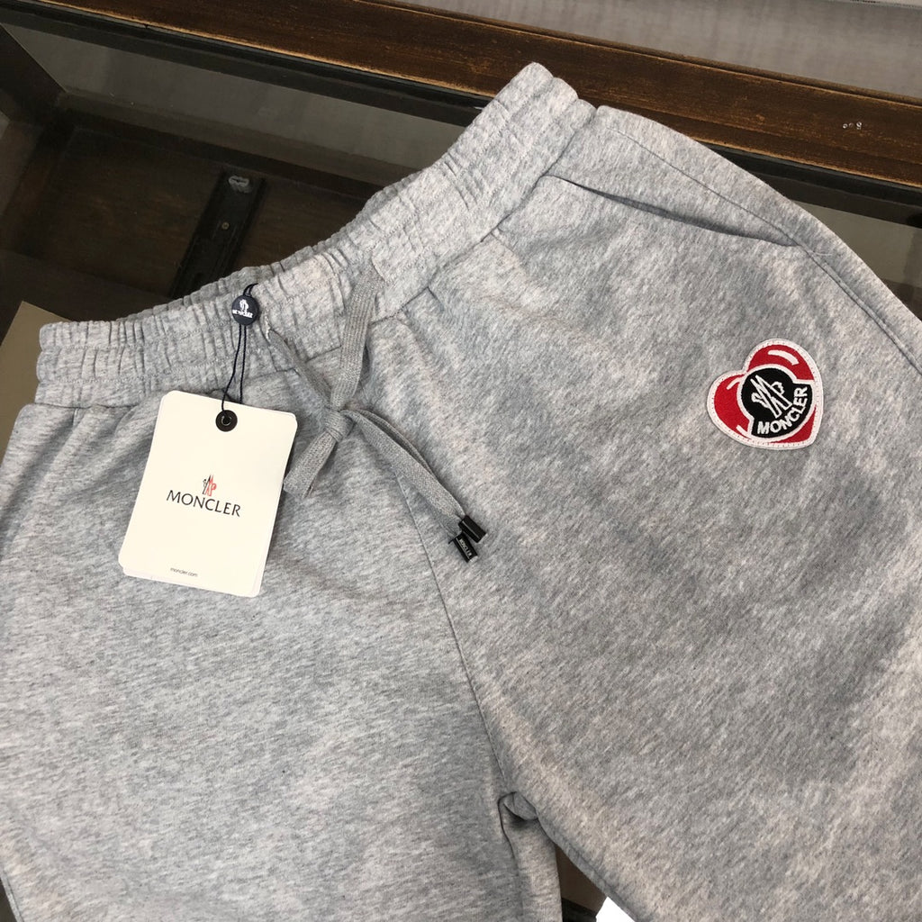 Heather gray Moncler logo shorts with drawstring and elastic waistband.