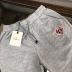 Heather gray Moncler logo shorts with drawstring and elastic waistband.
