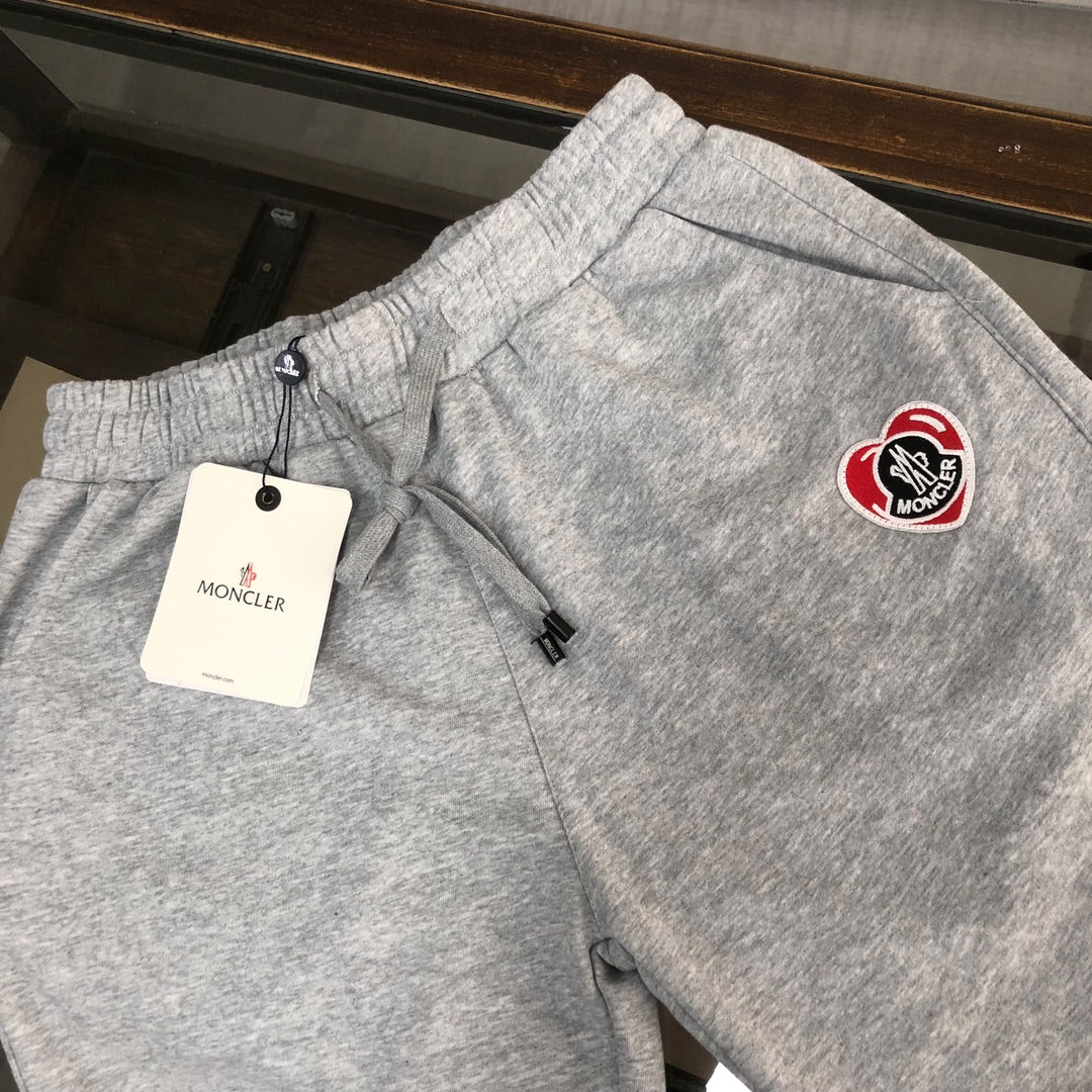 Heather gray Moncler logo shorts with drawstring and elastic waistband.