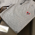 Heather gray Moncler logo shorts with elastic waistband and drawstring.