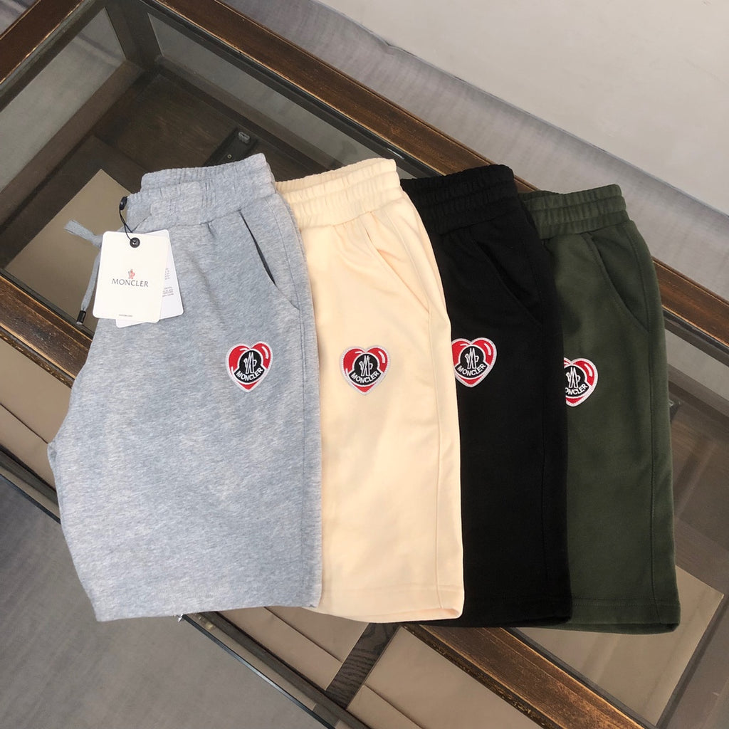 Stone Island shorts set: gray, cream, black, and dark green with logo patch
