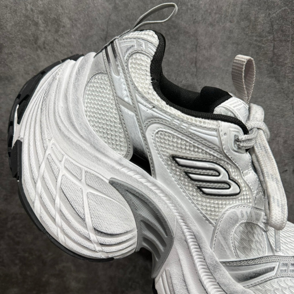 Unisex luxury sneaker side profile in silver with black collar lining and lace-up