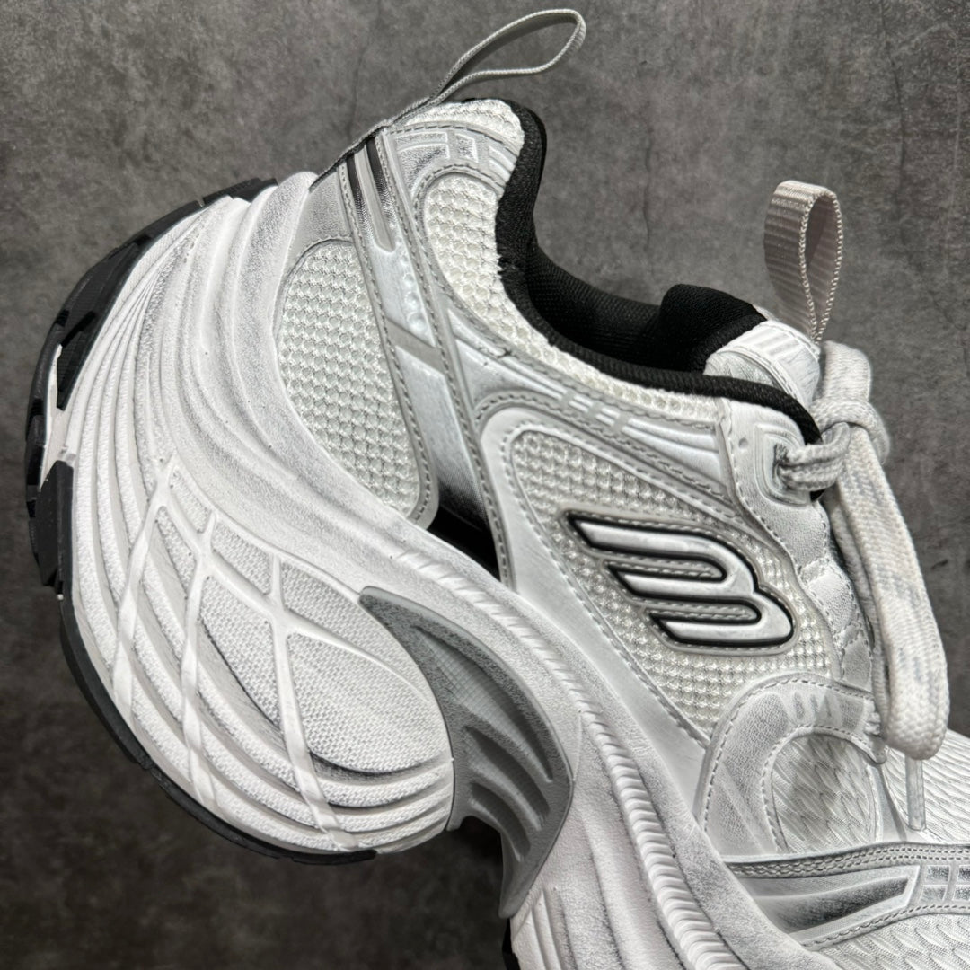 Unisex luxury sneaker side profile in silver with black collar lining and lace-up