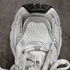 Unisex luxury sneaker tongue and lace area in silver with fabric eyelets