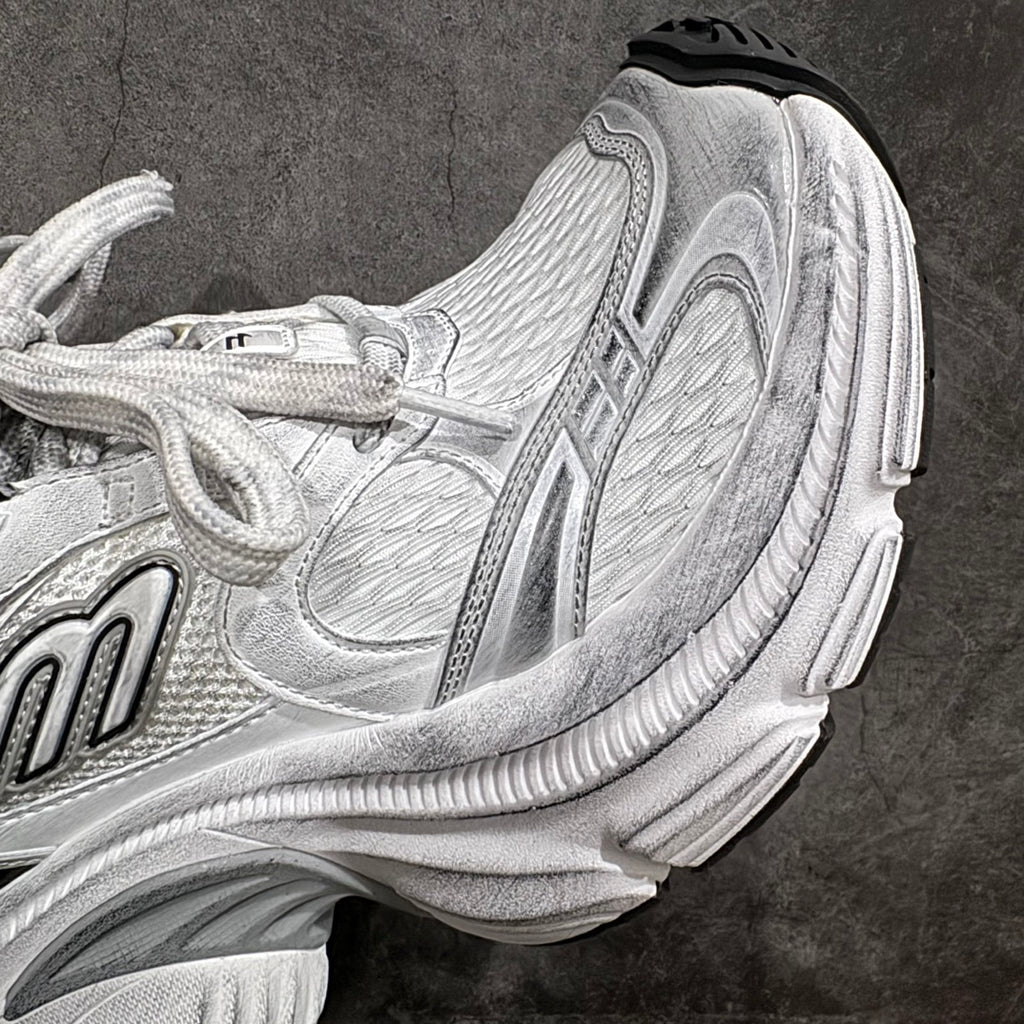 Unisex luxury sneaker side close-up in silver with layered cushioning details