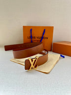 Louis Vuitton belt with brown strap, gold-tone LV buckle, and embossed pattern
