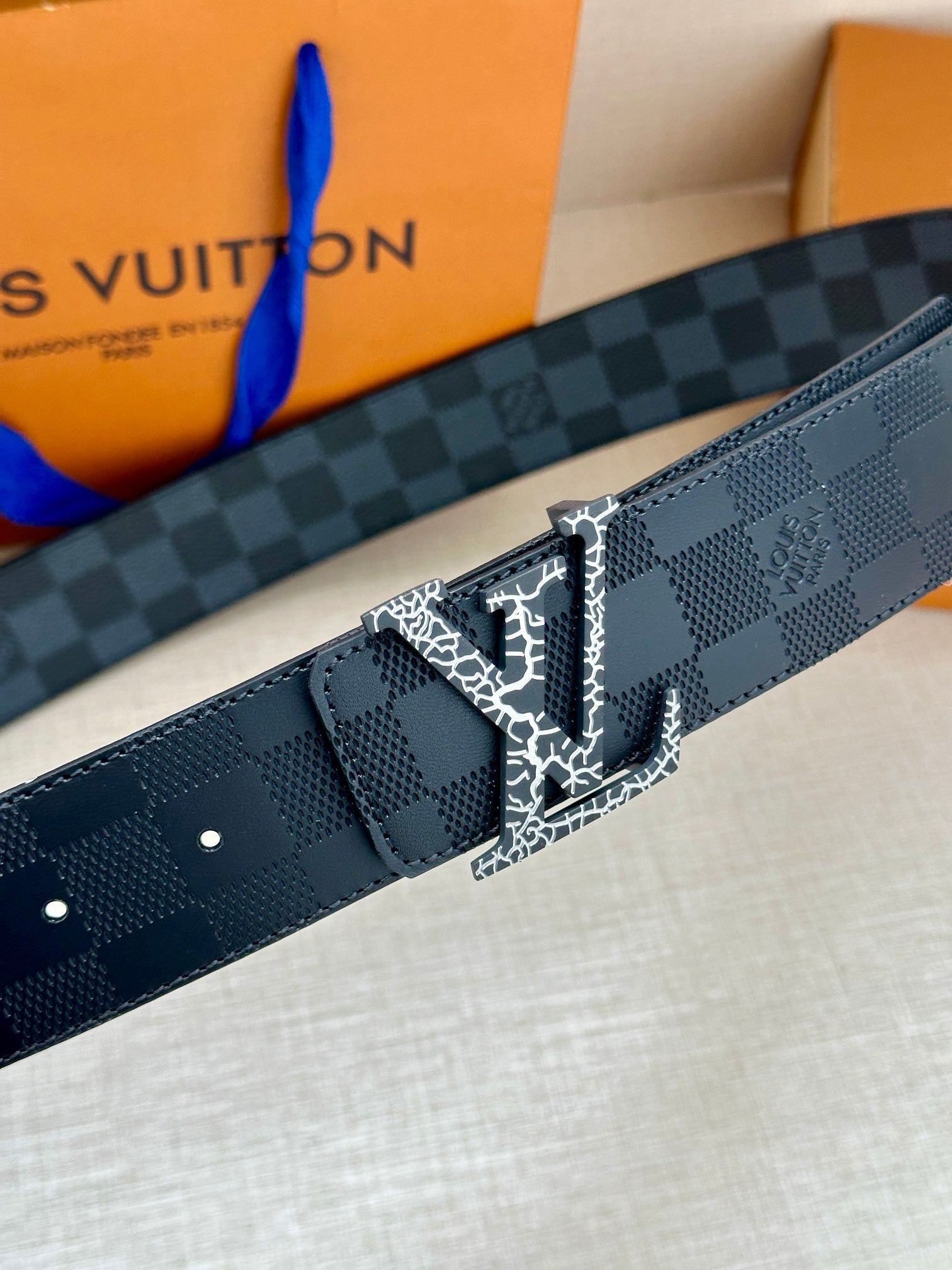 Louis Vuitton belt, dark blue checkered pattern with silver-tone LV buckle and keeper