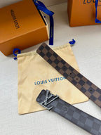 Louis Vuitton belt strap with dark checker pattern and metallic LV buckle detail