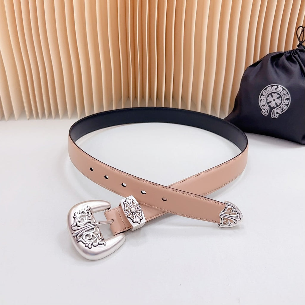 Tan leather belt with ornate silver-tone buckle and navy trim, adjustable eyelets