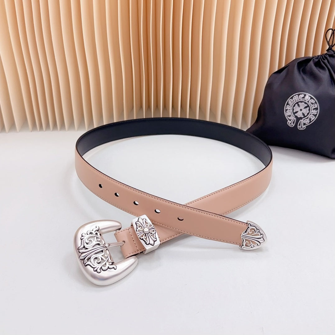 Tan leather belt with ornate silver-tone buckle and navy trim, adjustable eyelets