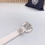 Beige leather belt end with chrome buckle and engraved floral corner details
