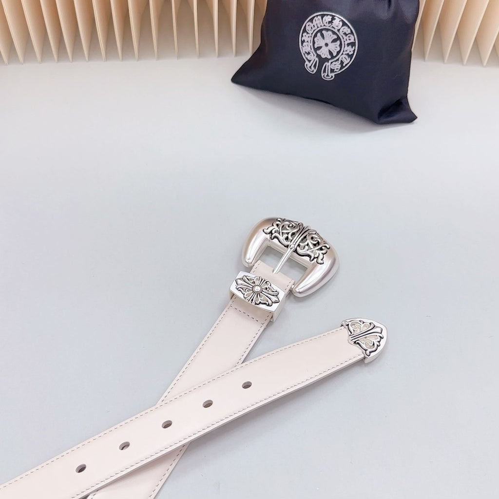 Beige belt strap with silver-tone buckle and engraved floral metal accents